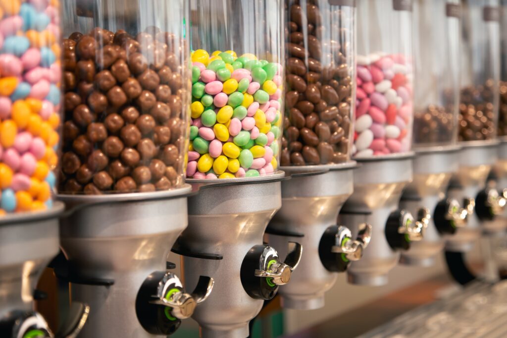 Bright candies in containers by weight in a candy store.